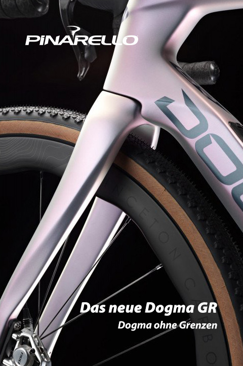 Das neue Dogma GR: Dogma ohne Grenzen. Das Bild zeigt den vorderen Teil eines Gravel-Bikes. Gabel, Bremsscheibe, Teile des Reifens, Teile des Rahmens und Teile des Lenkers sind erkennbar. Es ist das neue Dogma GR.